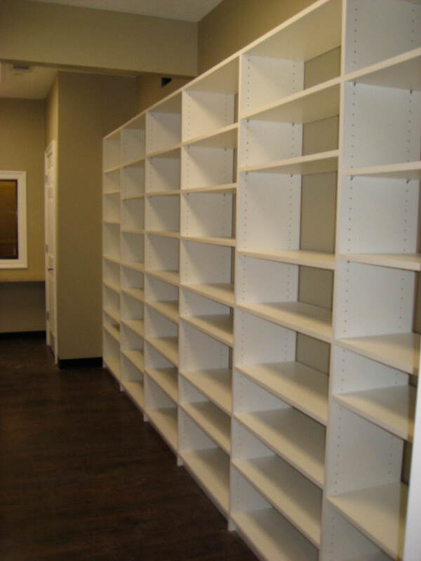 White bookshelves line this office for additional filing - Lake Charles LA - Custom Office Solutions - ShelveIt